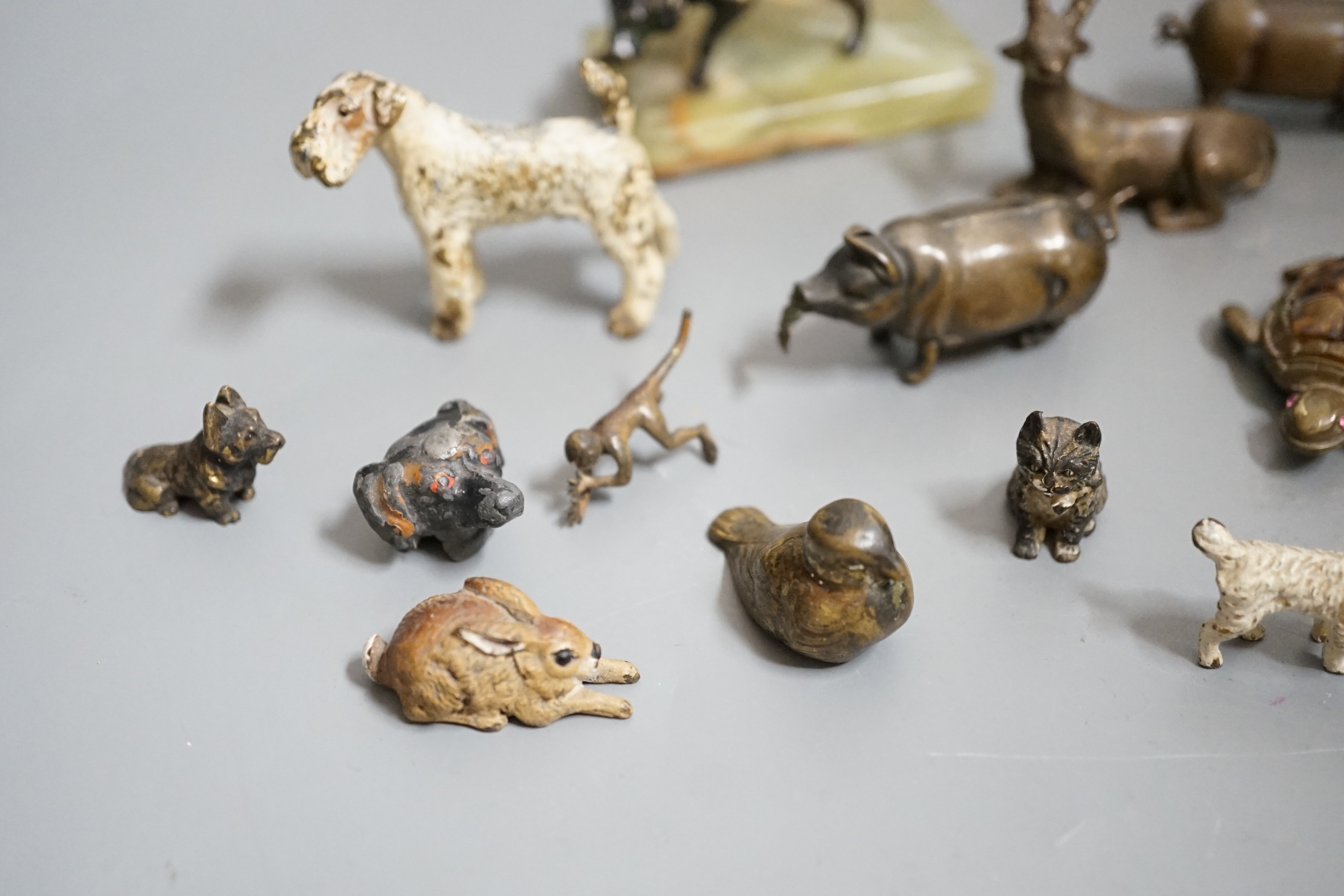 A quantity of animal related collectables including cold painted bronzes, a ‘pig’ tape measure and vesta etc.